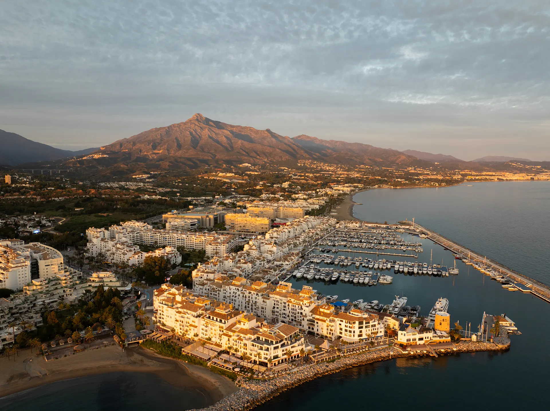 Property prices in Marbella shown through residential areas, villas, and coastal views