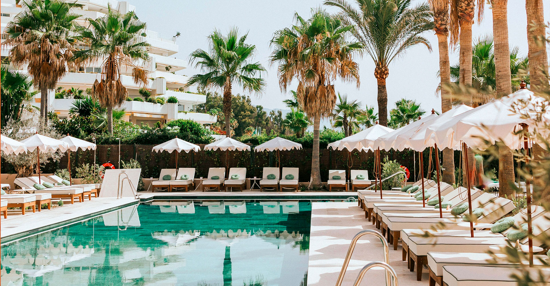 Beach club with sunbeds, restaurant, and sea views in a relaxed coastal setting