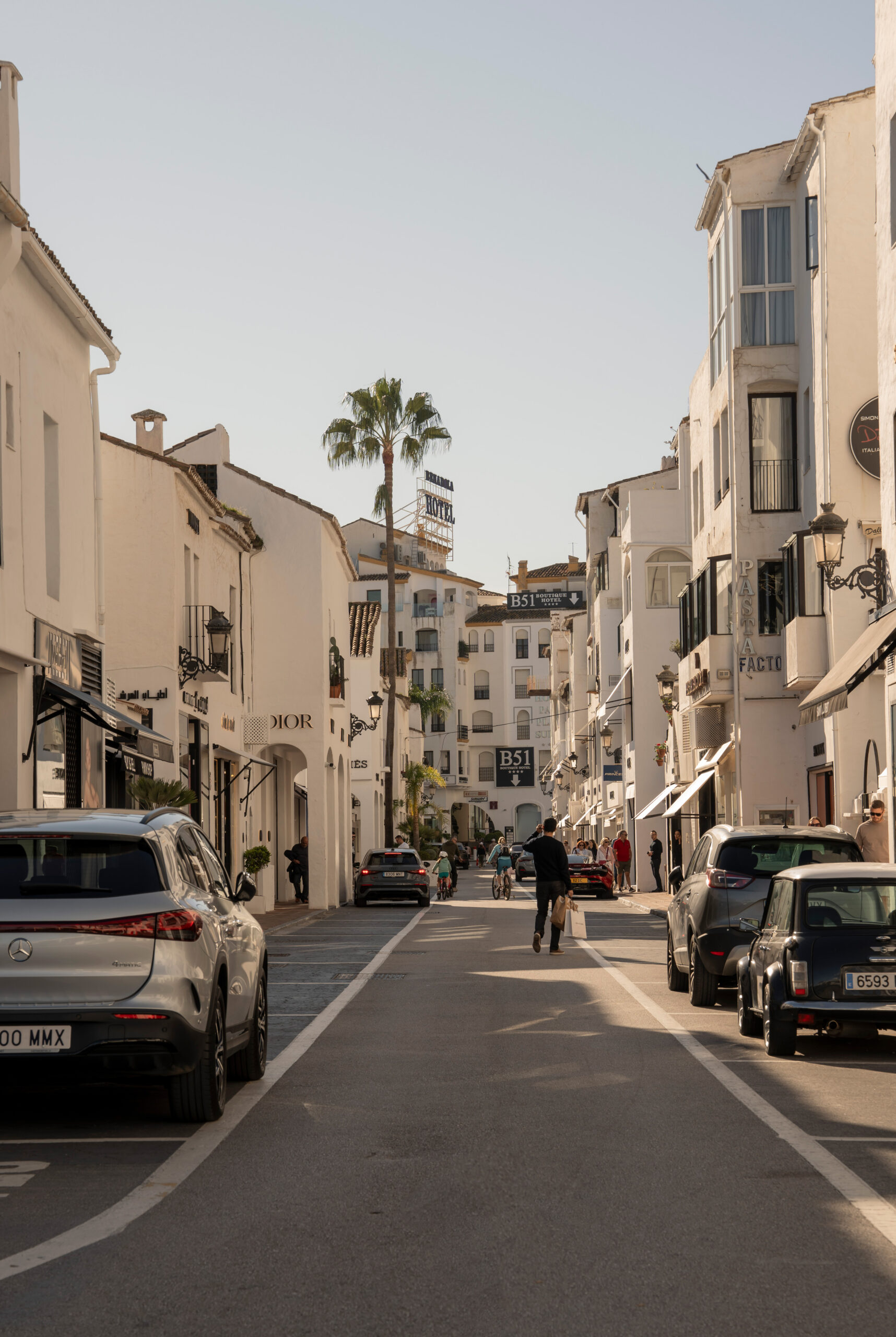 Puerto Banús marina with luxury yachts, waterfront restaurants, and coastal views