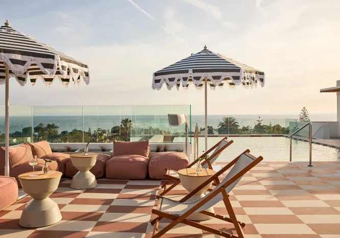 Rooftop restaurant in Marbella with outdoor seating, sea views, and a relaxed dining atmosphere