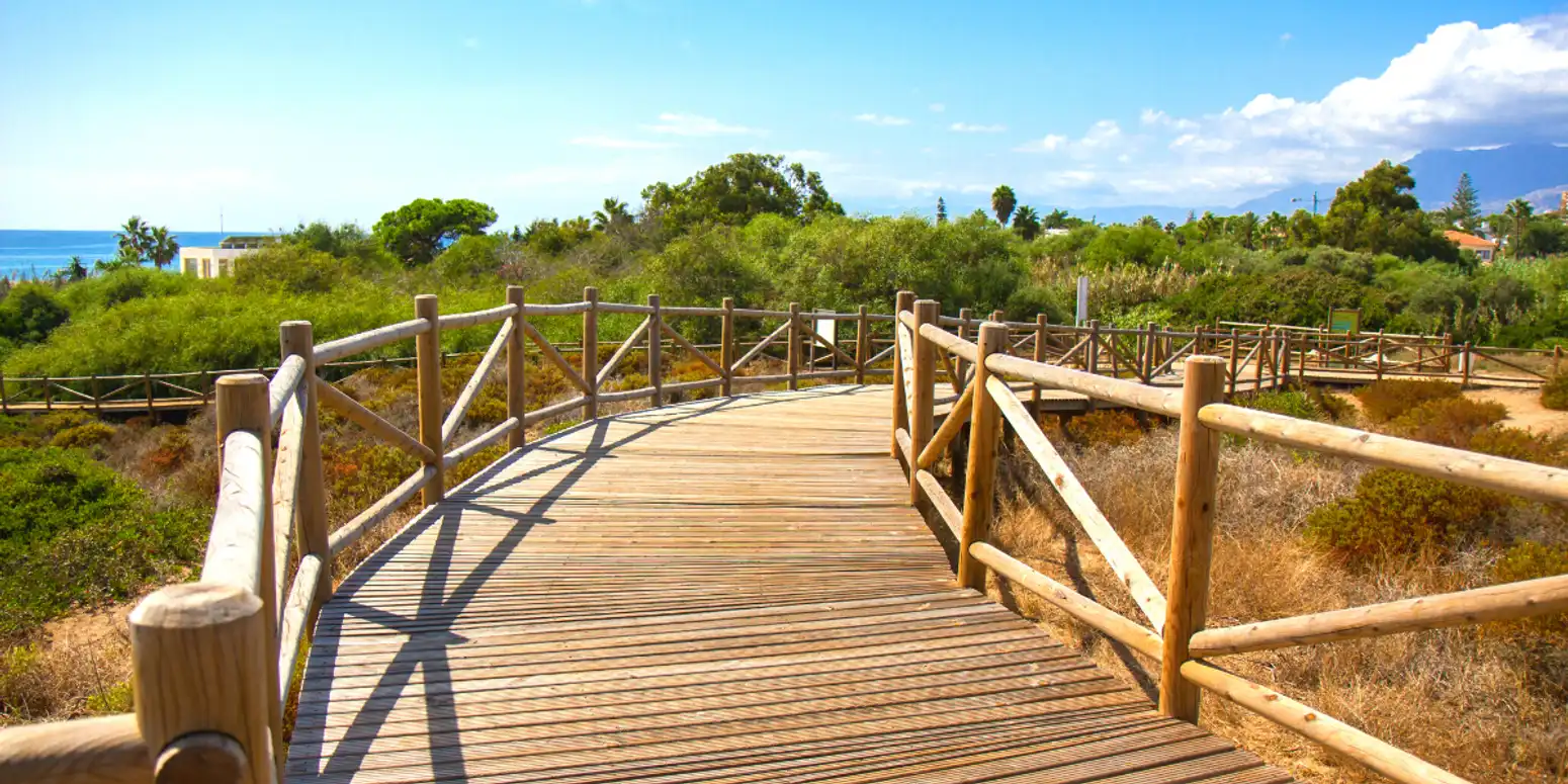 Cabopino Beach in Marbella with sandy dunes, Mediterranean views, and a more natural coastal setting