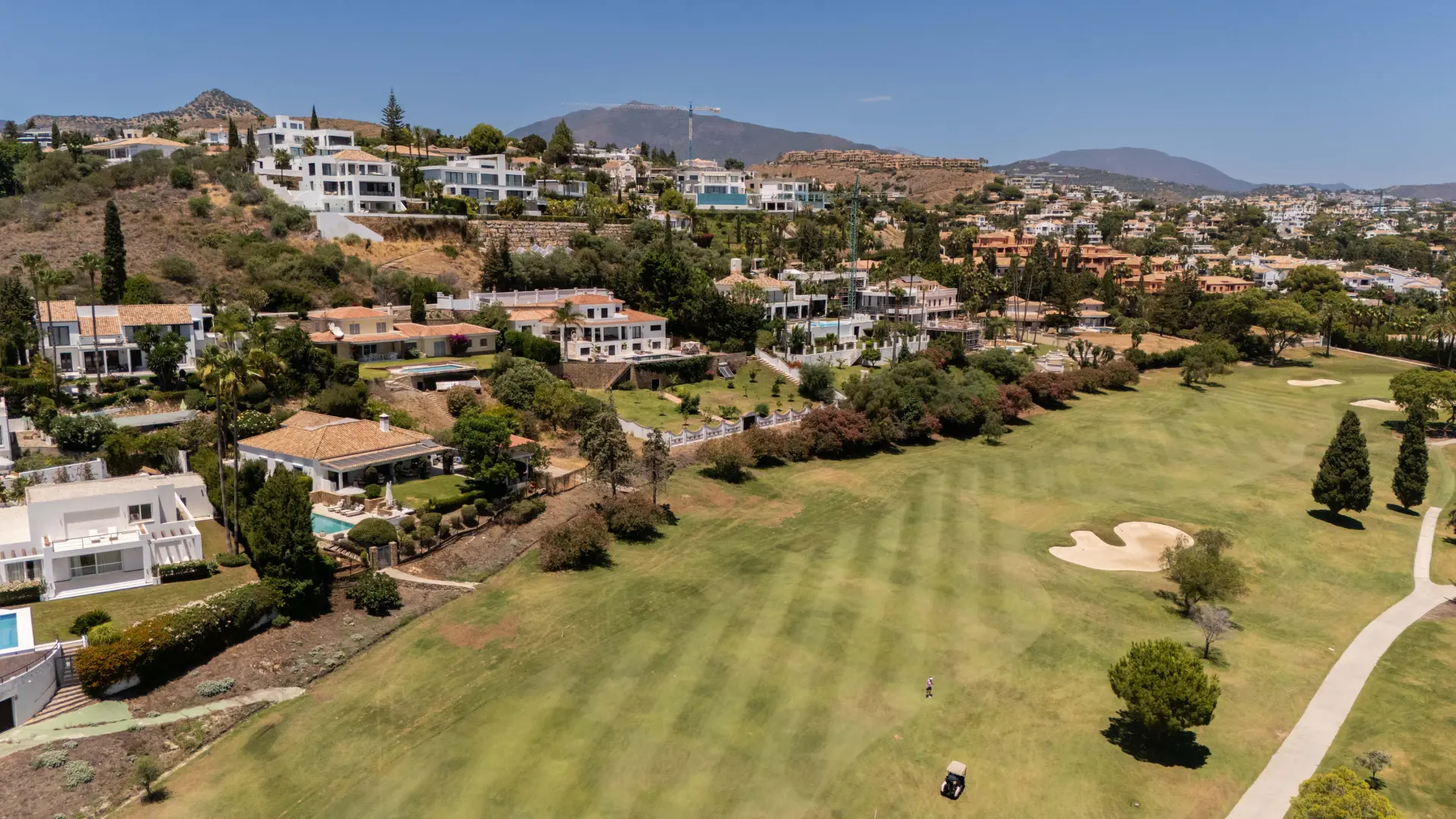 Panoramic view of El Paraíso on the New Golden Mile with golf courses, Mediterranean coastline, and surrounding greenery