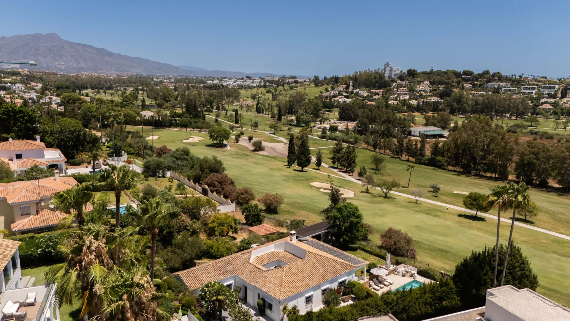 Panoramic landscape of El Paraíso on the New Golden Mile, featuring golf courses, villas, and Mediterranean views