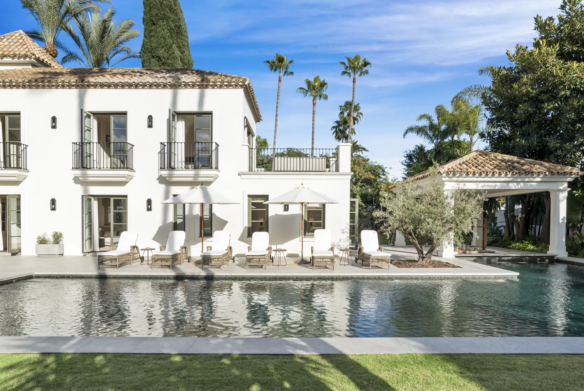 Luxury villa in Marbella with private pool, garden, and outdoor living spaces