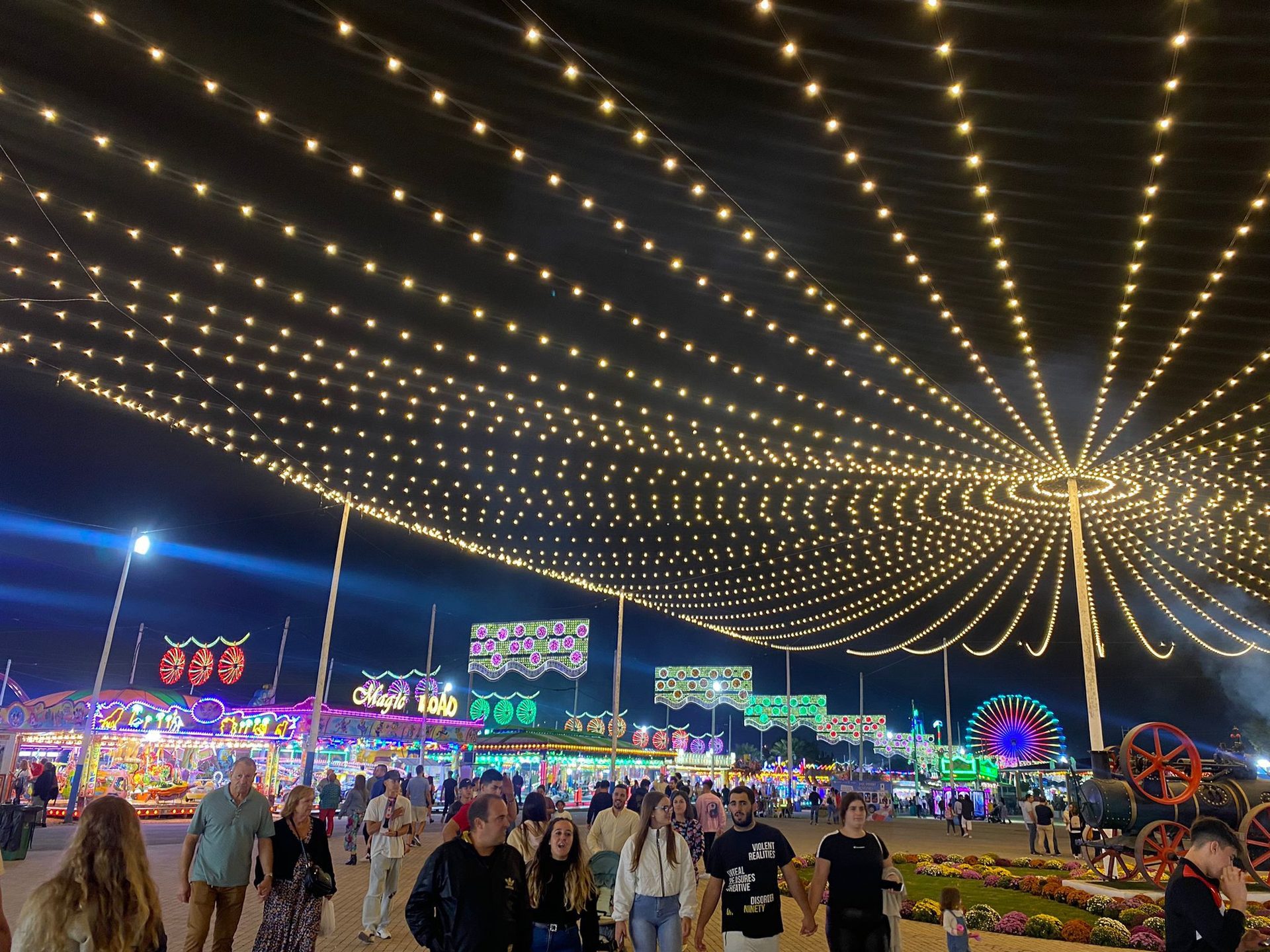 Feria y Fiestas de San Pedro Alcántara during autumn in Marbella with fairground lights and evening crowds